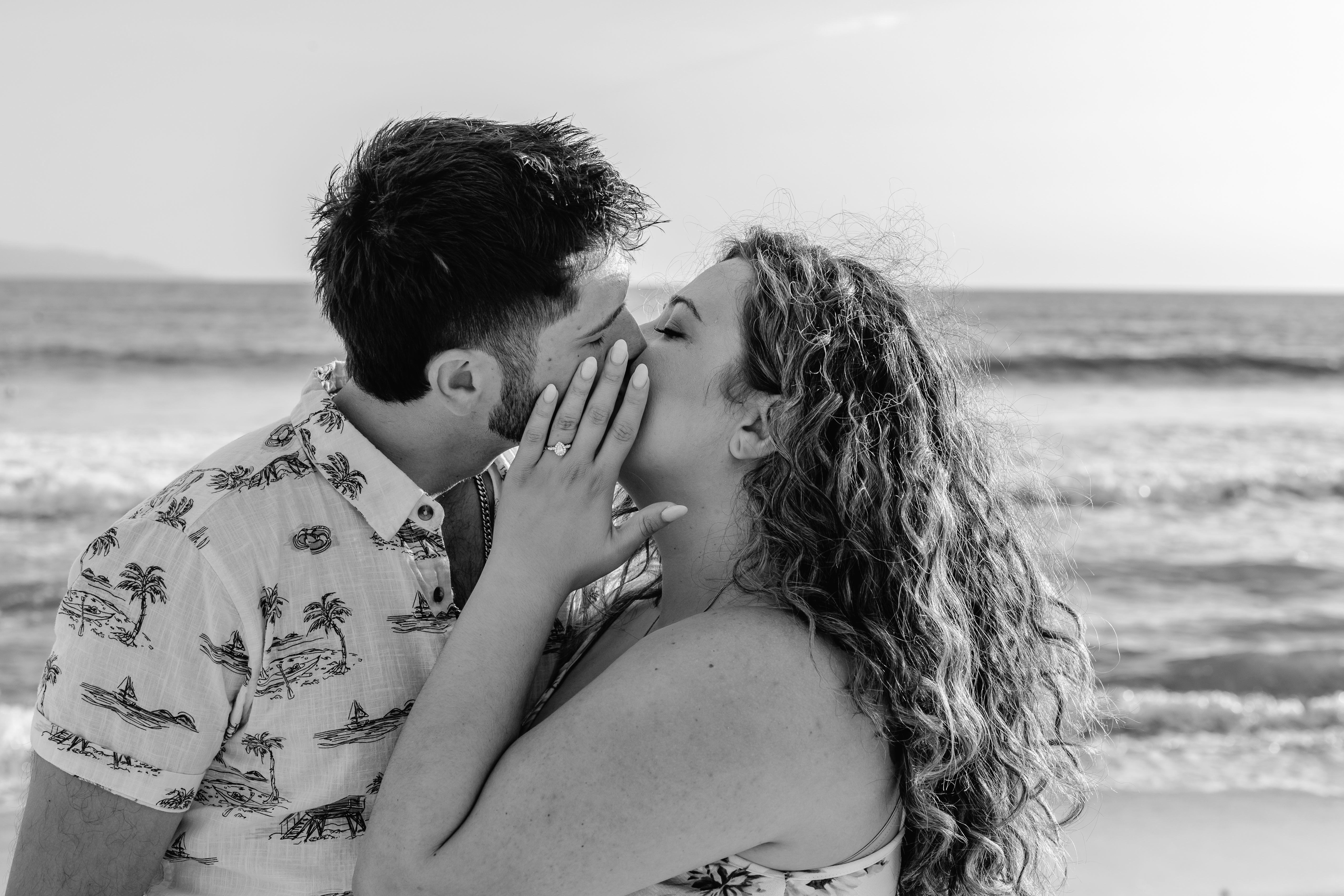 A couple kissing on a beach