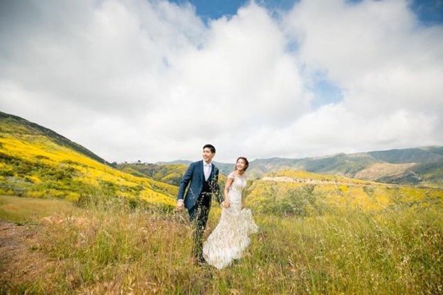 Krislyn and Joe posing for picture in a field