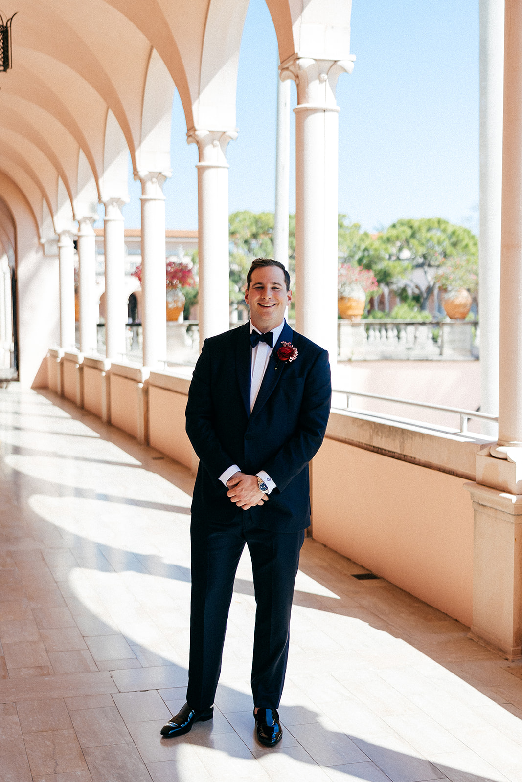 A person in a suit and tie stading for photoshoot